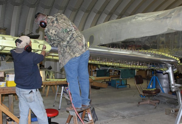 XP-82 Twin Mustang Restoration - March 2014 Update 11 Riveting the right-hand wing leading edge skins. (photo via Tom Reilly)