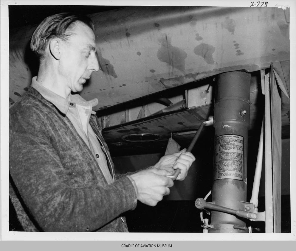 Inside the Engineering of the Republic P-47 Thunderbolt 27 Male worker tightening bolt on P 47 shock for landing gear strut
