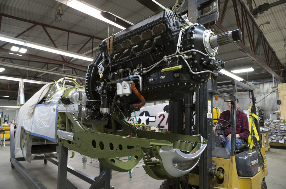 Texas Flying Legends P-51C Restoration Report 21 The engine going in last spring. (photo via AirCorps Aviation)