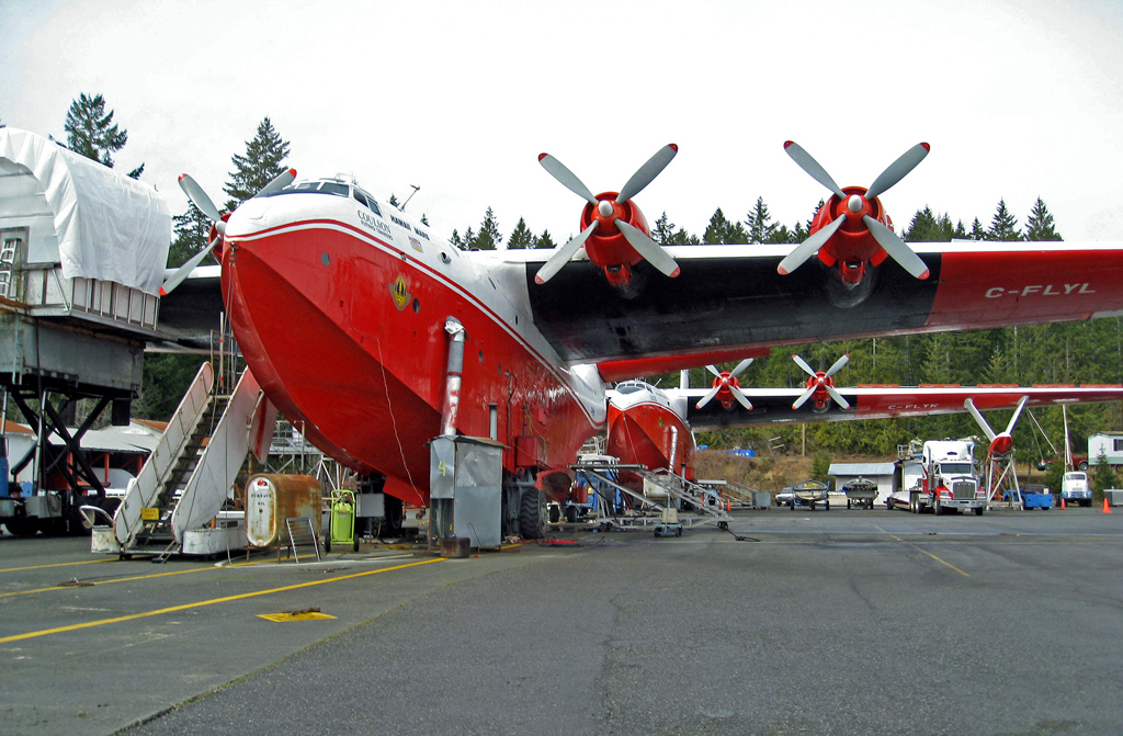 Martin Mars Going to to EAA AirVenture Oshkosh 2016! 12 Hawaii Mars beached in the foreground a few years ago during winter maintenance, with Philippine Mars to the rear, much as they look today, with the exception that Philippine now sports a beautiful, post-war gloss navy blue paint scheme. (photo via Wikipedia)