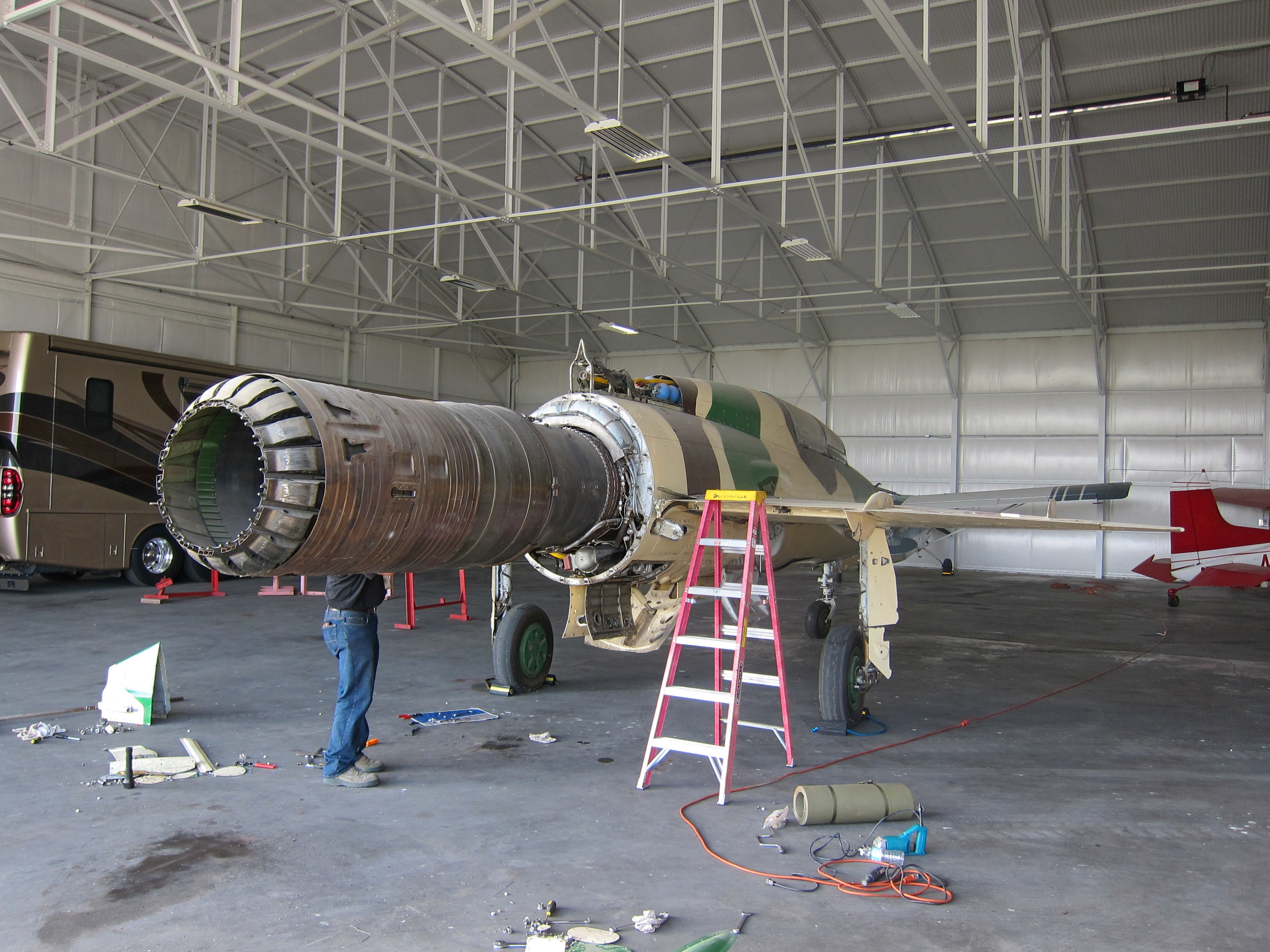 MiG-21U Mongul-B Airworthy Restoration to Begin in Australia 11 The forward fuselage and engine of Adrian Deeth's freshly imported MiG-21UM in his hangar in Perth, Australia. (photo via Phil Buckley)