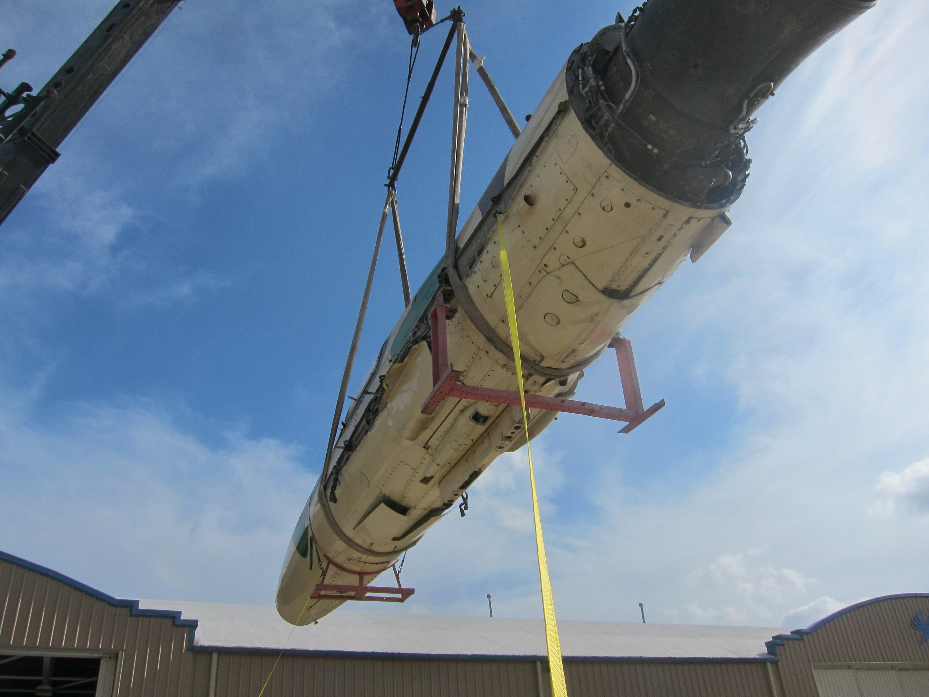 MiG-21U Mongul-B Airworthy Restoration to Begin in Australia 12 The forward fuselage and engine of Adrian Deeth's freshly imported MiG-21UM hoisted from its shipping crate in Perth, Australia. (photo via Phil Buckley)