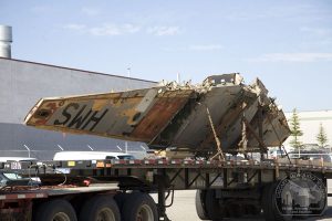 The Long and Winding Road of the City of Calgary's Mosquito Finally Leads to a Restoration 19 Mosquito wing, showing extensive weathering, on the move. (Image Credit: Calgary Mosquito Society)