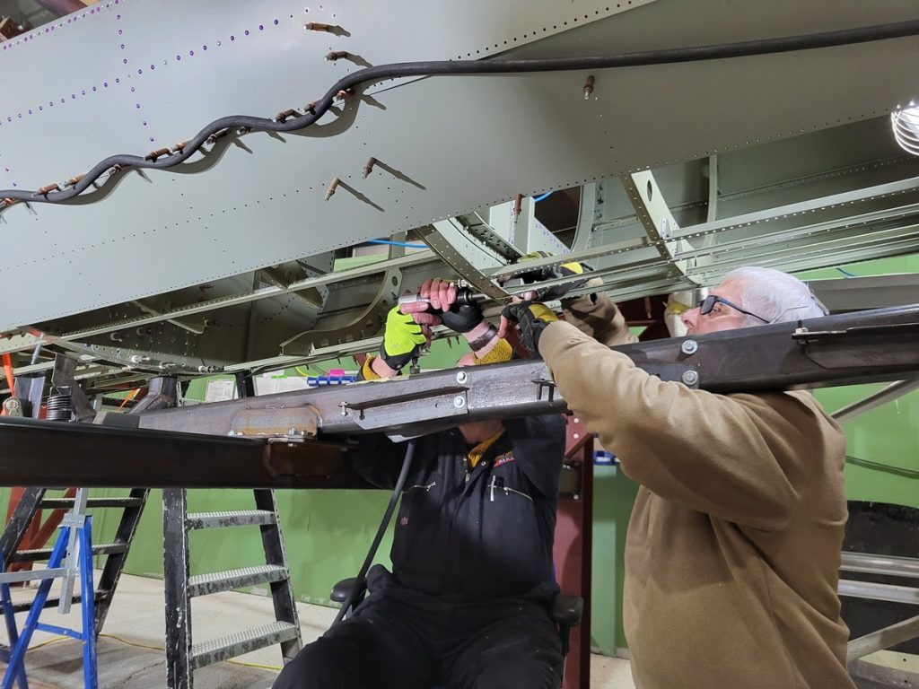Lancaster NX611 ‘Just Jane’ – Restoration Update 240 and 241 11 Norm and Terry riveting the structure around the tail oleo box aperture of the rear fuselage of NX611
