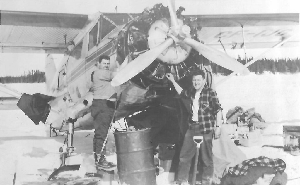 Yanks Norseman Nears Completion 10 Norseman CF IJG Original Caption Roy Kinch Left Dunc Robinson Right REPAIRING A BLOWN JUG ON A C CF IJG AT SAKAMI LAKE CIRCA 1960 Courtesy of Rodney Kozar Norseman Festival e1717074728565