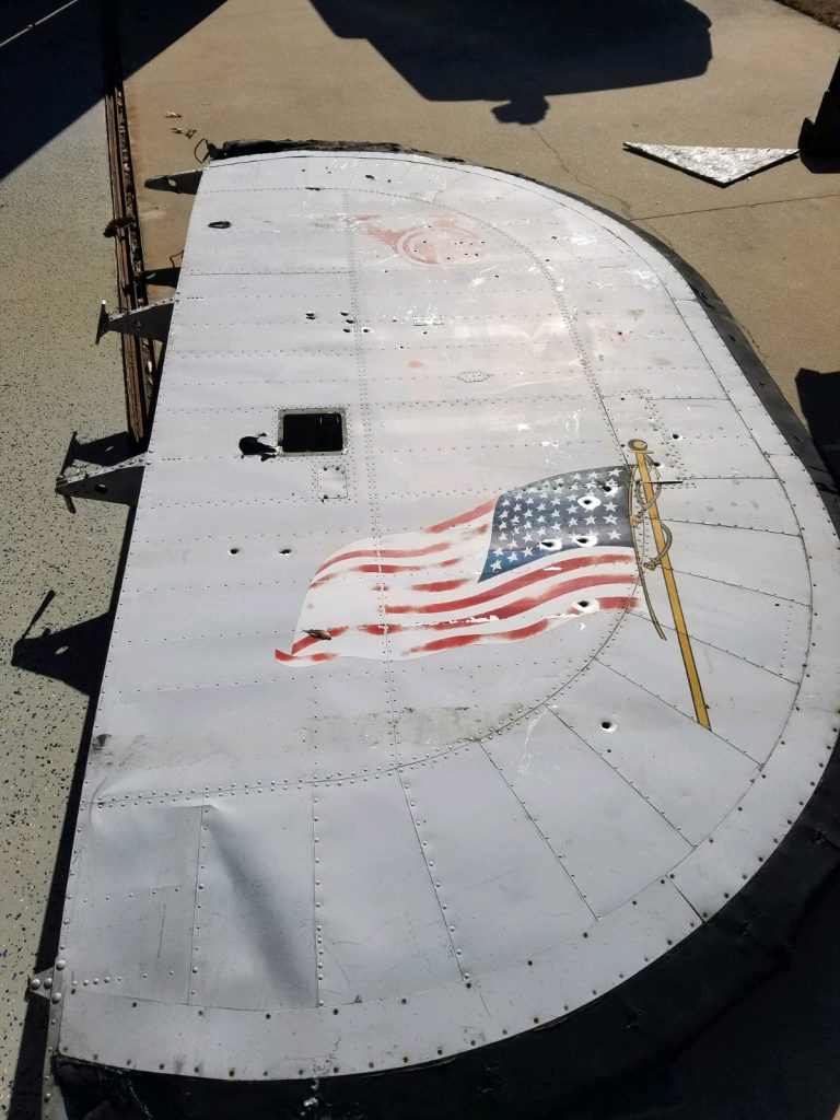 Restoration Begins: Project Warbird Breathes New Life into Consolidated LB.30 Liberator II AL557 15 One of the vertical stabilizers from Maid of Athens still in her Morrison Knudsen colors