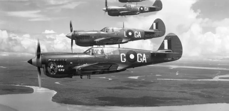 Soaring by the Sea Foundation Repaints P-40 Warhawk in Honor of Pappy Boyington 23 P 40 Kittyhawks of 75 Squadron over Port Moresby. USAAF Photo