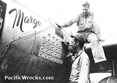 Pacific Wrecks' Led Expedition Finds Richard Bong’s P-38 in South Pacific 13 PacificWrecks.com Captain Richard I. Bong watches his crew chief paints a new Japanese flag on the scoreboard on P 38J Marge 42 103993
