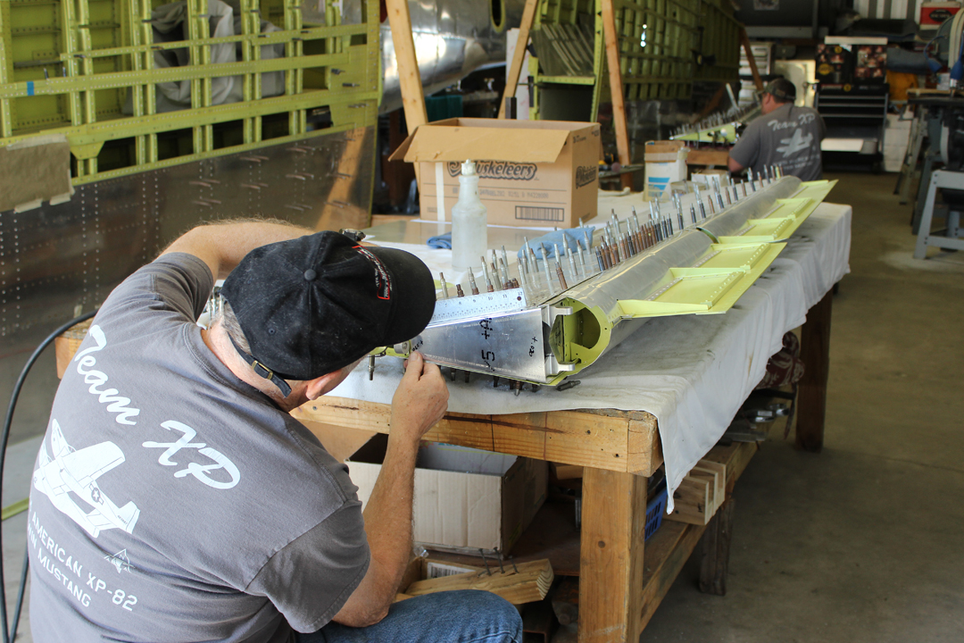 XP-82 Twin Mustang - Feb.-April, 2015 - Restoration Update 26 Paul Randall working on the left hand aileron. (photo via Tom Reilly)