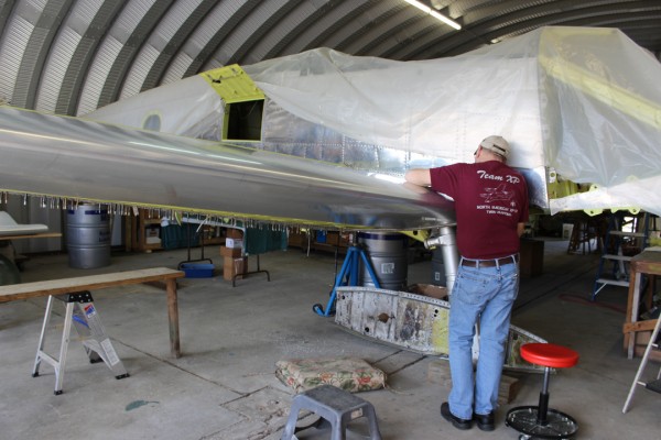 XP-82 Twin Mustang Restoration - February 2014 Update 13 Paul checking the fit of the leading edge skins on the right-hand outer wing panel. (photo via Tom Reilly)