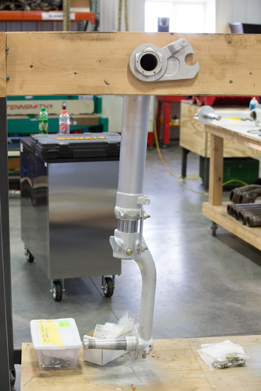 Texas Flying Legends P-51C Restoration Report 40 One of the main undercarriage legs temporarily fitted into a wooden support for painting. (photo via AirCorps Aviation)