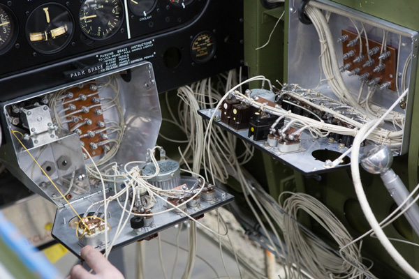 Texas Flying Legends P-51C Restoration Report 33 This tight view lets us see the many connections that have to be neatly and securely made in just these two boxes in order to have a reliable electrical system.(photo via AirCorps Aviation)