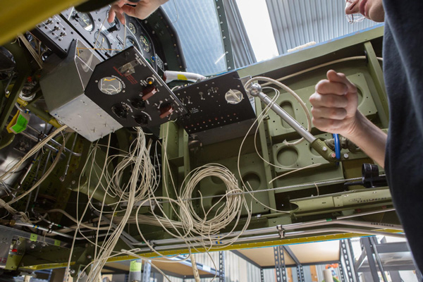 Texas Flying Legends P-51C Restoration Report 29 The complex wiring looms going into the cockpit, as seen from below the fuselage. (photo via AirCorps Aviation)