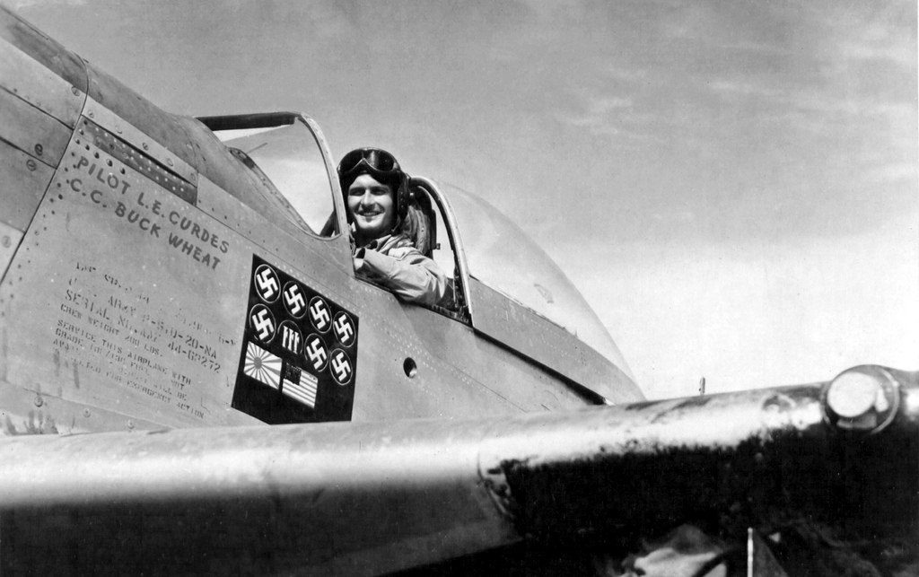 Props and Pin-Ups in World War II (and it’s just not girls in bikinis…) 16 Pilot Lt. Louis Curdes in his P 51 Mustang Bad Angel.