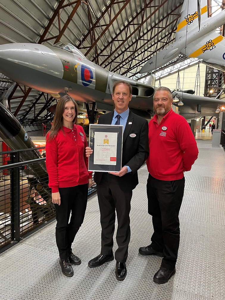 It’s Gold For The RAF Museum Midlands 10 RAF Museum Operations Manager Alan Edwards Centre and Visitor Experience Assistants Louise Hammond Left and Charlie Cooper Right