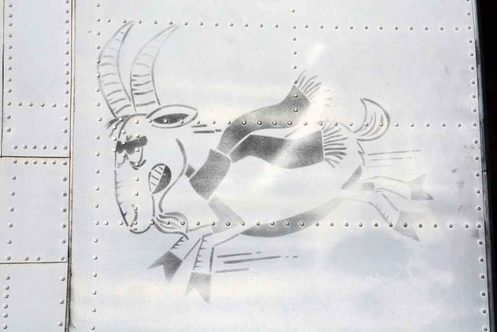 138th Aviation Company Memorial - July, 2016 Update 16 The unusual "bucking goat" motif stenciled upon RU21A 67-18113's fuselage, as seen when the aircraft was in Dynamic Aviation's storage compound. This will be faithfully re-applied to the airframe after the new paint goes on. (photo by Bryan Miklos)