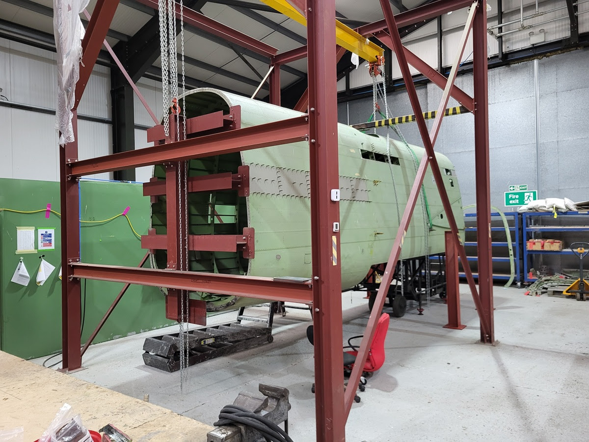 Avro Lancaster B.VII NX611 ‘Just Jane’ – Restoration Update 248 10 Rear mid fuselage of NX664 in the jig awaiting the forward end attchaments to be finished