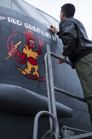 The Family Legacy Continues, Col.Paul Tibbets IV Qualifies on B-52 11 U.S. Air Force Capt. Kerry Baker applies nose art on a 93rd Bomb Squadron B-52H Stratofortress, Nov. 15, 2013, Barksdale Air Force Base, La. The original "Red Gremlin" nose art was on a World War II B-17 bomber piloted by Brig. Gen. Paul Tibbets, Jr. (U.S. Air Force photo by Master Sgt. Greg Steele/Released)