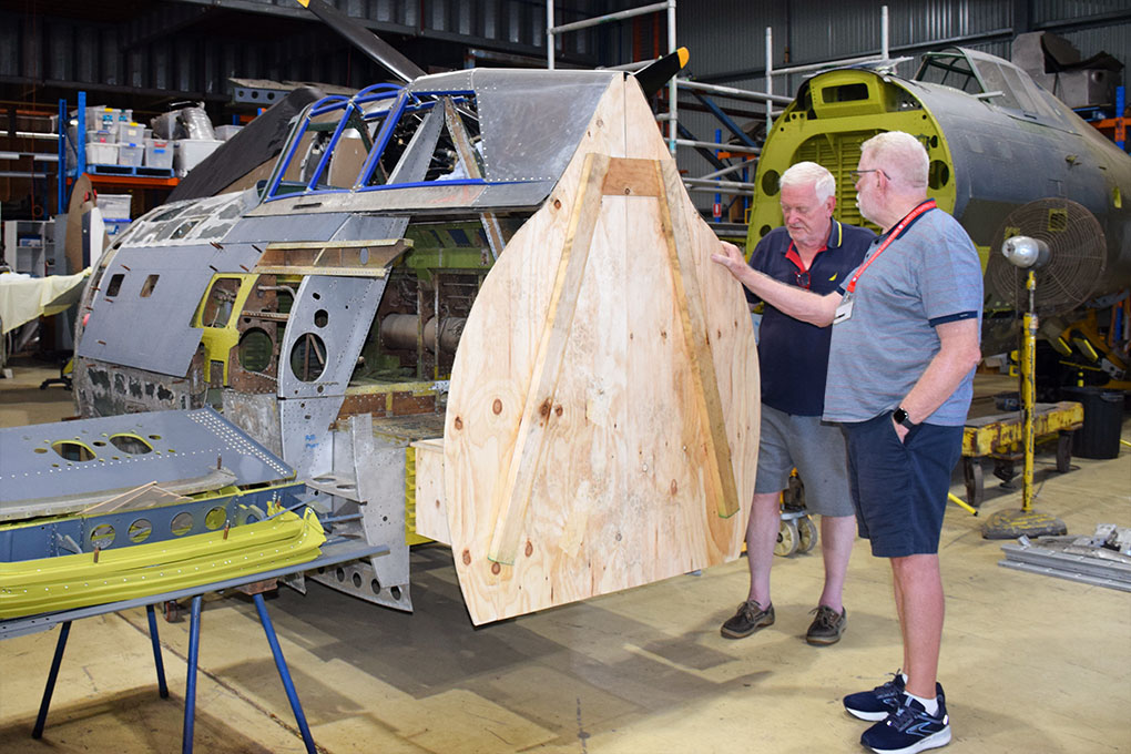 P-47 Thunderbolt Restorations Progress in Australia, Including Proposed Two-Seat Conversion 15 Republic P 47D prototype for a unique two seat conversion inspected by John Parker right and Robert Greinert left