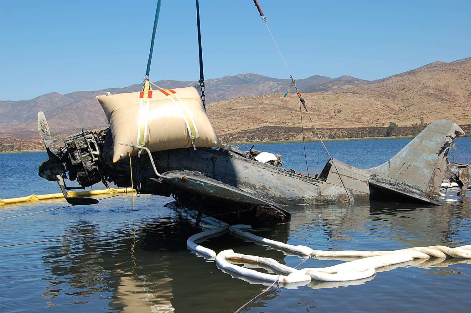 Curtiss SB2C-4 Helldiver Project Arrives at USS Midway Museum 18 The start of the lift recovering SB2C-4 Helldiver Bu.19866 from Lower Otay Reservoir near San Diego, California in August, 2010. This aircraft is likely going to be one of the first involved in the newly updated Navy Trade & Exchange Program. (Photograph by Jasmine Miller via Taras Lyssenko)