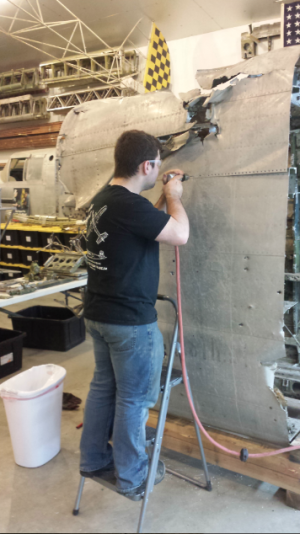 B-25 "Sandbar Mitchell" Update 11 One of the High School students that Patrick has assembled to help him with the restoration.