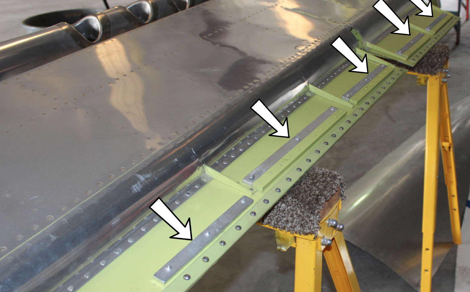 XP-82 Twin Mustang - December 2016 - Restoration Update 21 The newly installed XP-82 aileron leading edge counterweights denoted by arrows. (photo via Tom Reilly)