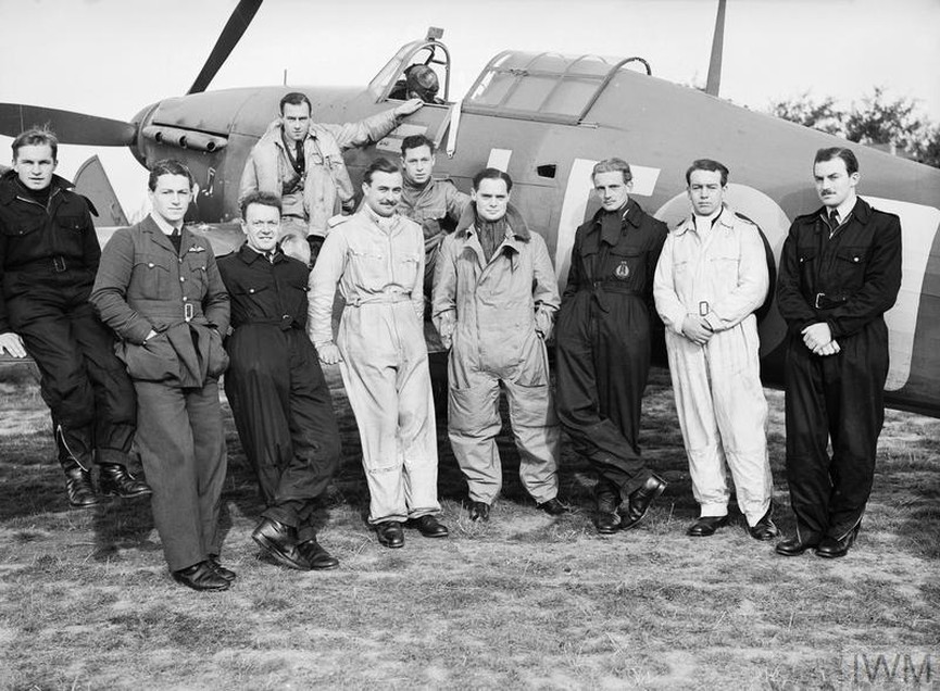 Spitfire: Evolution of an Icon 11 Squadron Leader Douglas Bader DSO front centre with some of the Canadian pilots of his Squadron 242 Canadian Squadron grouped around his Hurricane fighter aircraft at Duxford. © IWM CH 1413 © IWM CH 1413