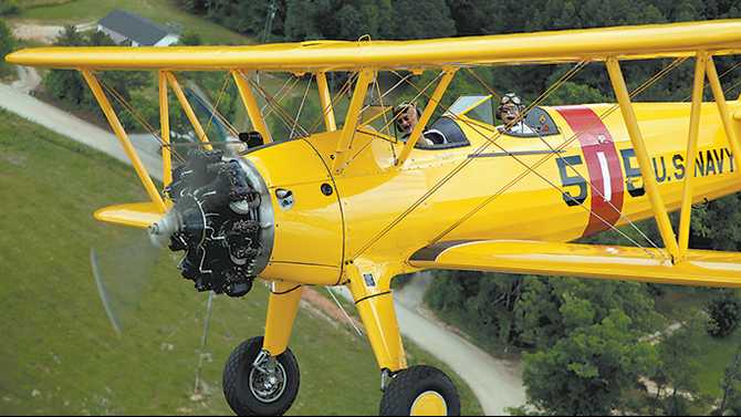 A VETERAN' STORY: A Progeny of Aviators 19 The author Pete Mecca in front seat and pilot John Laughter in rear seat.
