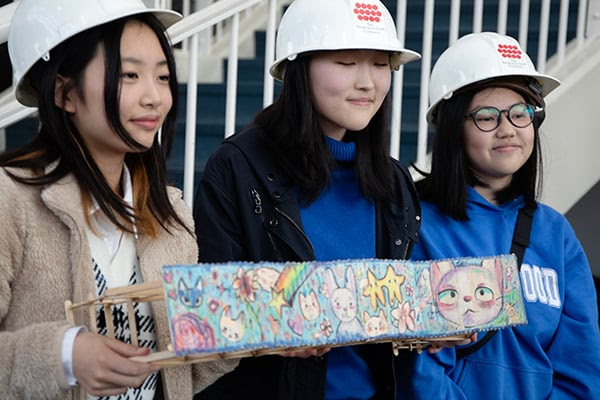 Students Build Bridges to Future STEM Careers at The Museum of Flight 10 Students pose with their colorful bridge at a previous Popsicle Bridge Building Competition at The Museum of Flight