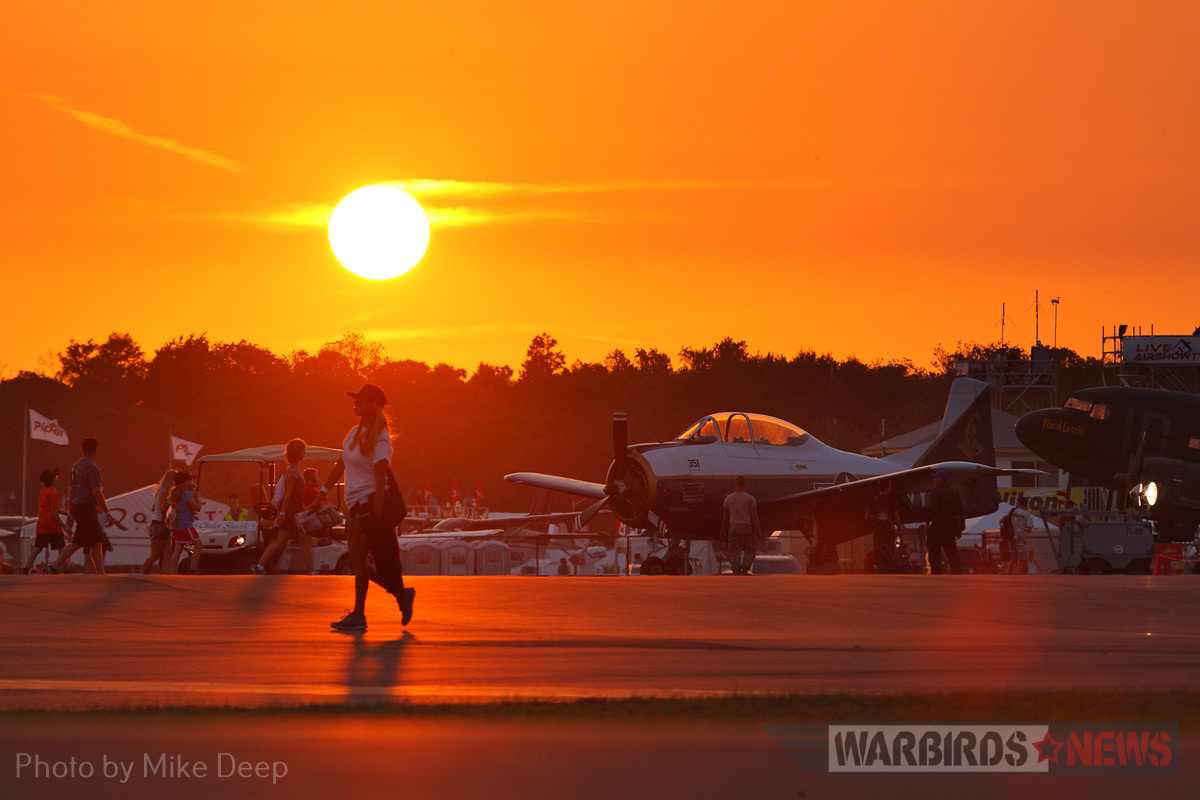 Sun 'n Fun 2017, The Report 19 The sun sets on the Warbird Ramp Wednesday. Earlier that evening, the Mustangs gathered here were whisked away to shelter in anticipation of an approaching storm front.