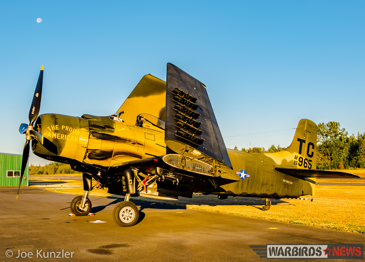 Props & Ponies at the Heritage Flight Museum - Air Show Report 14 Sunrise on the Skyraider with the moon just above the propeller. (photo by Joe Kunzler)