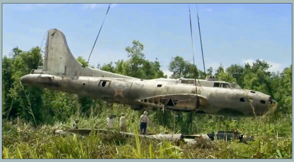 The Swamp Ghost and the Fight to Protect Pacific War Wrecks 14 Swamp Ghosts fuselage being lifted by helicopter