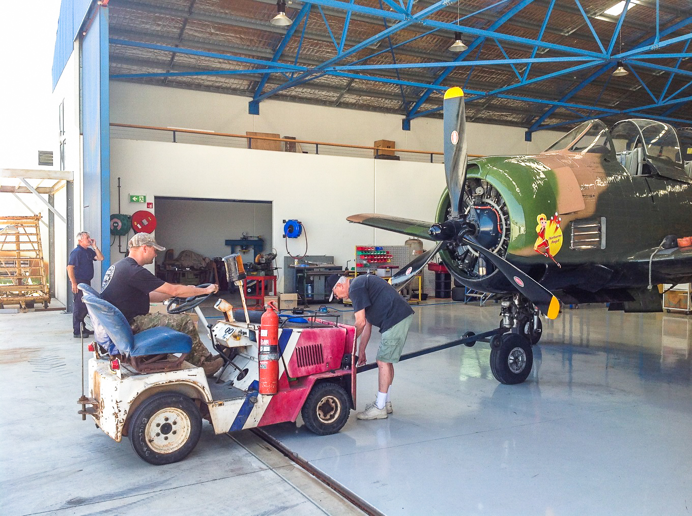 Combat Veteran T-28D Trojan Returning to Flight Downunder 13 Towing the Trojan out for an engine run. (photo by Chris Godfrey)
