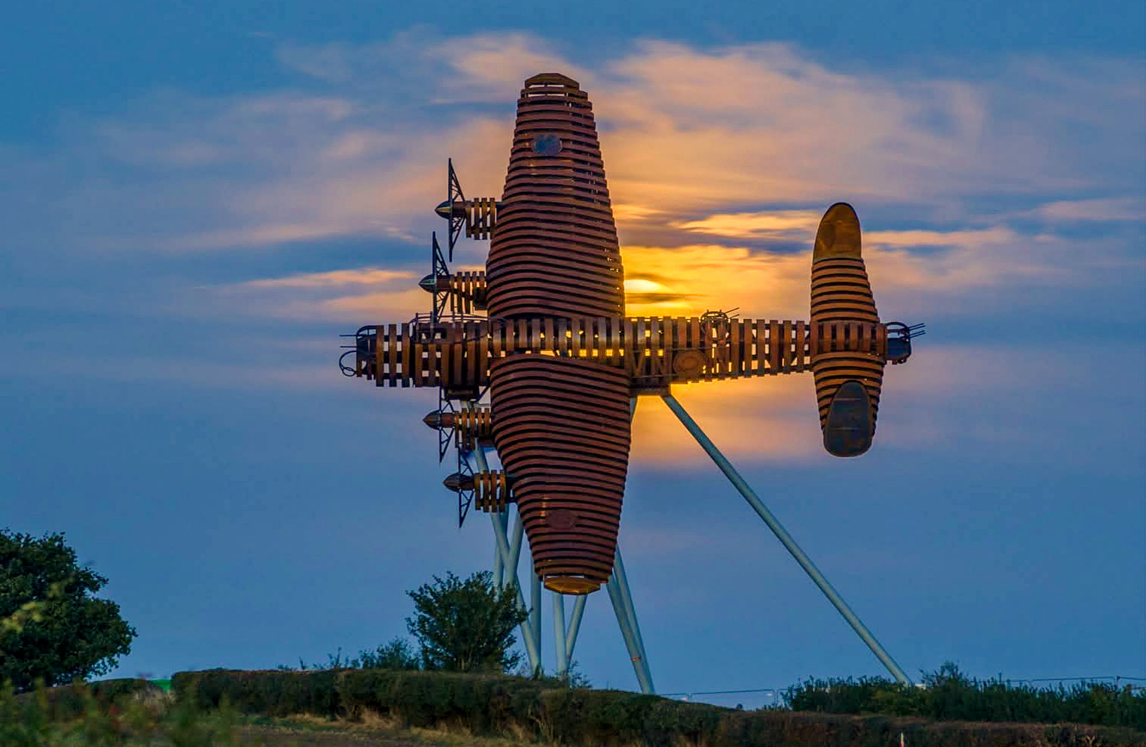 “On Freedom’s Wings” – Lancaster Bomber Sculpture Unveiled at Lincolnshire Gateway 13 The Bomber County Gateway Lancaster sculpture On Freedoms Wings at sunset