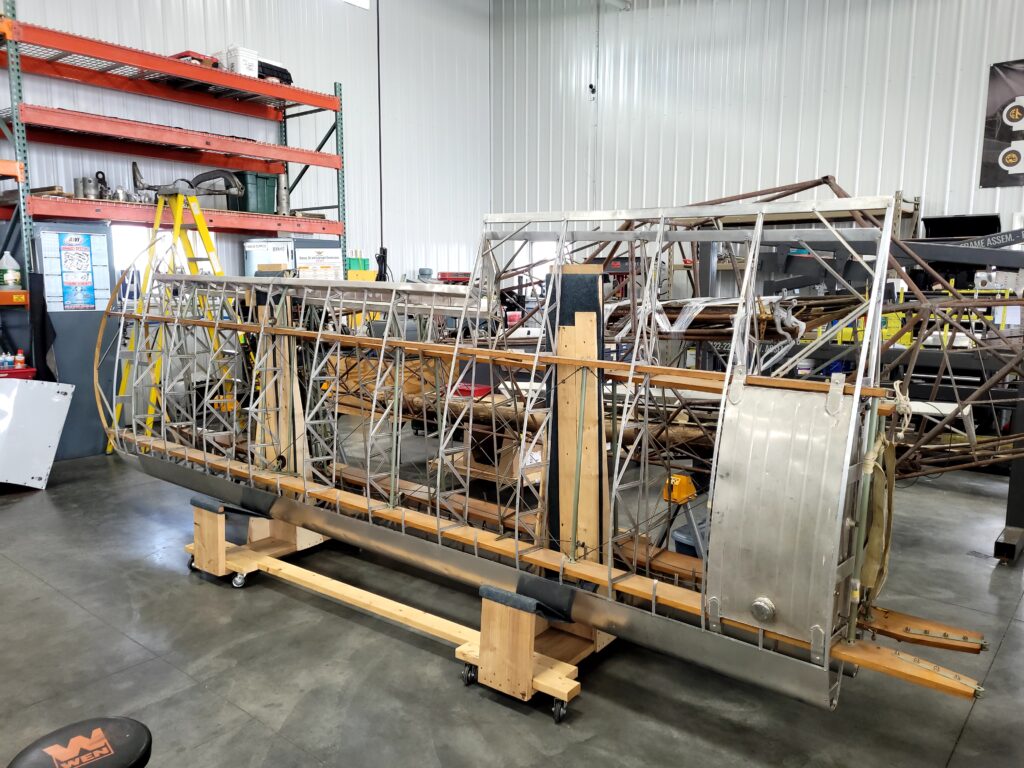 Aircorps Aviation's Newest Restoration Project, The Piper L-4H Grasshopper 16 The L 4 Grasshopper wings are carefully stored in the AirCorps Aviation hangar