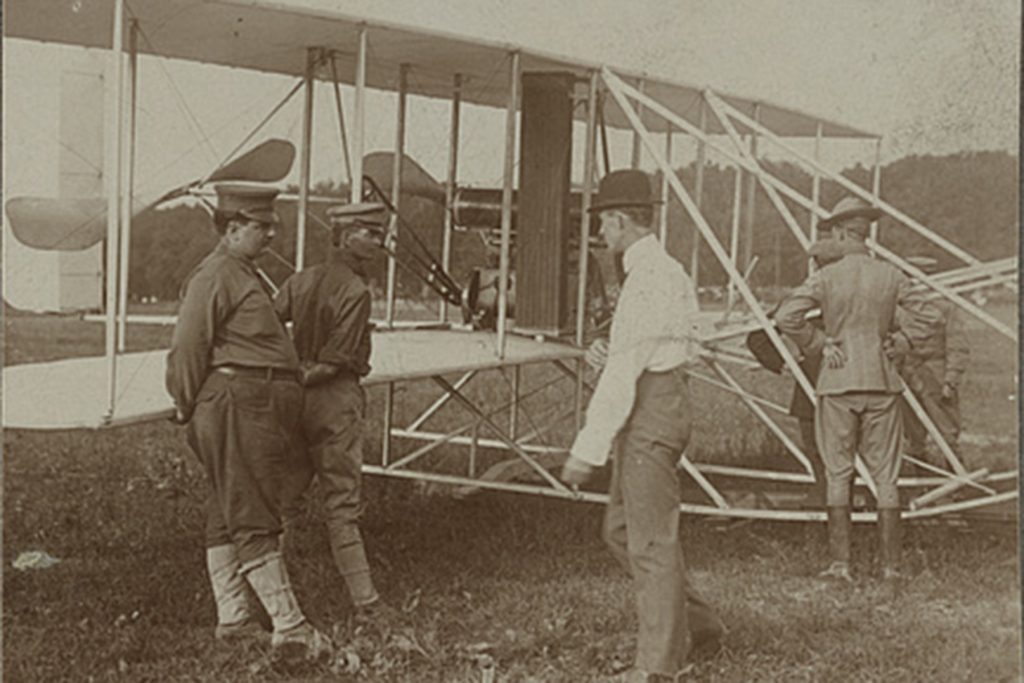 Spirit of Flight Museum Marks Wright Brothers Legacy with New Monument 12 The Wright brothers and some Army Signal Corps soldiers work on the Wright Military Flyer as they test it out at Fort Myer Virginia 1909.