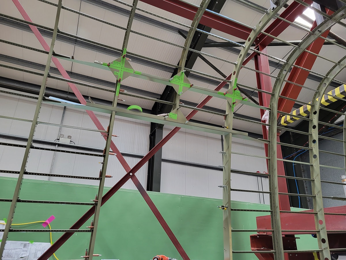 Lancaster NX611 ‘Just Jane’ – Restoration Update 226 20 The final fishplates pinned in place around the door opening in preparation for final fitting