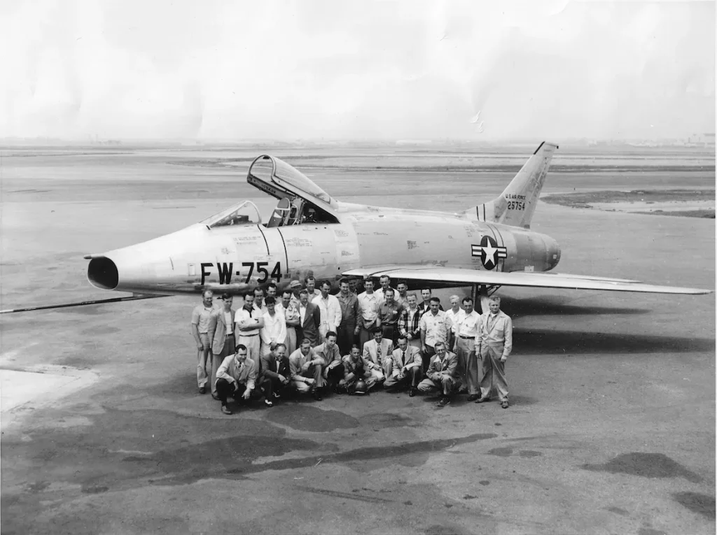 Today in Aviation History: First Flight of the North American F-100 Super Sabre 12 The prototype North American Aviation YF 100A Super Sabre 52 5754 with the North American F 100 team. Chief Test Pilot George