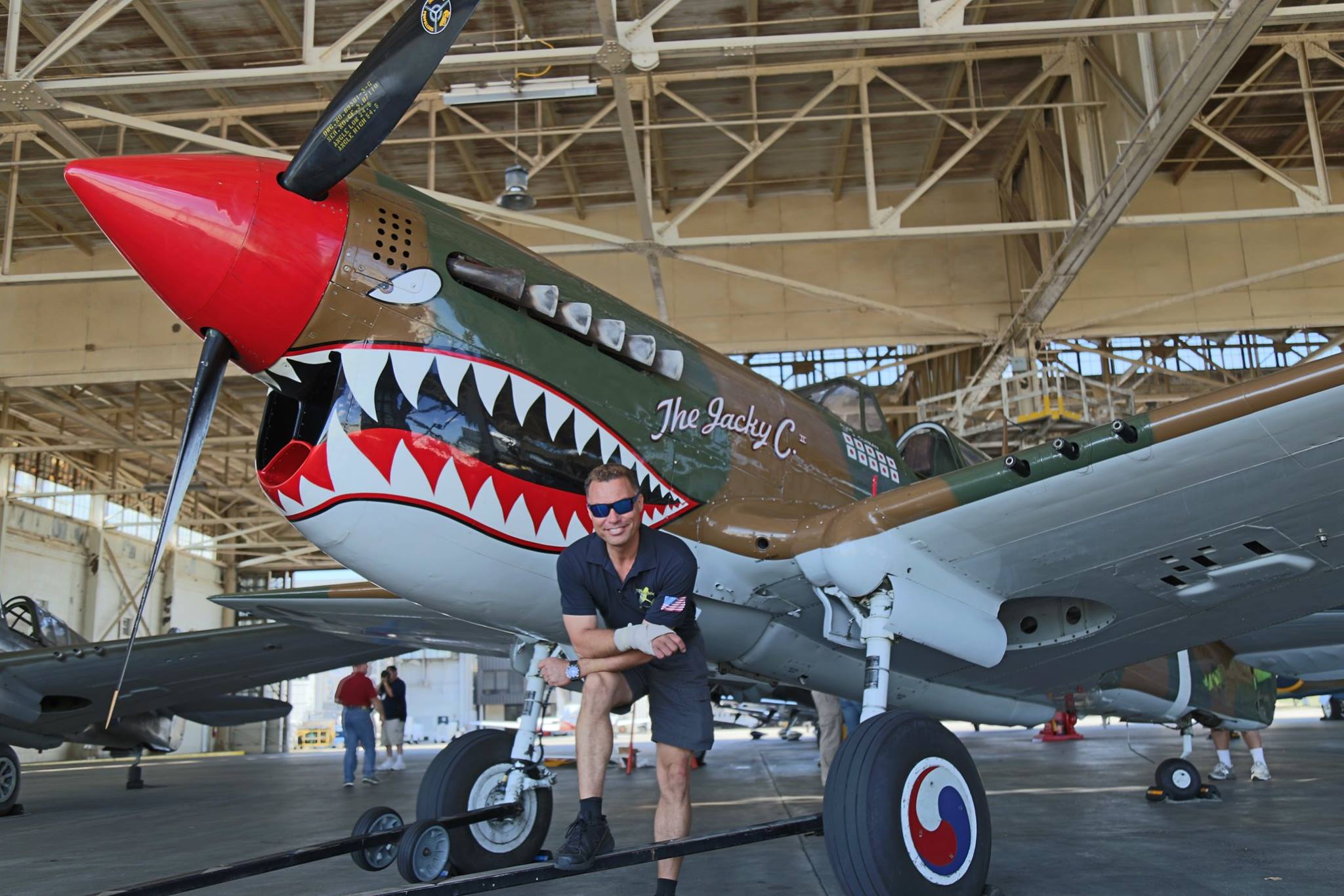 Warbird Bucket List 11 Thom Richard in front of the American Airpower Museum's P-40 in occasion of the 2016 Atlanta Warbird Weekend. (Photo by Kenneth Strohm)