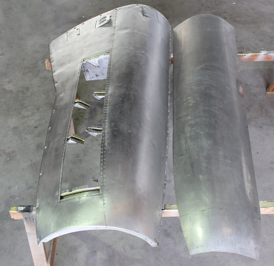 XP-82 Twin Mustang - December 2016 - Restoration Update 14 A completed cowling panel (left) beside the newly wheeled skin for its counterpart to the right. (photo via Tom Reilly)