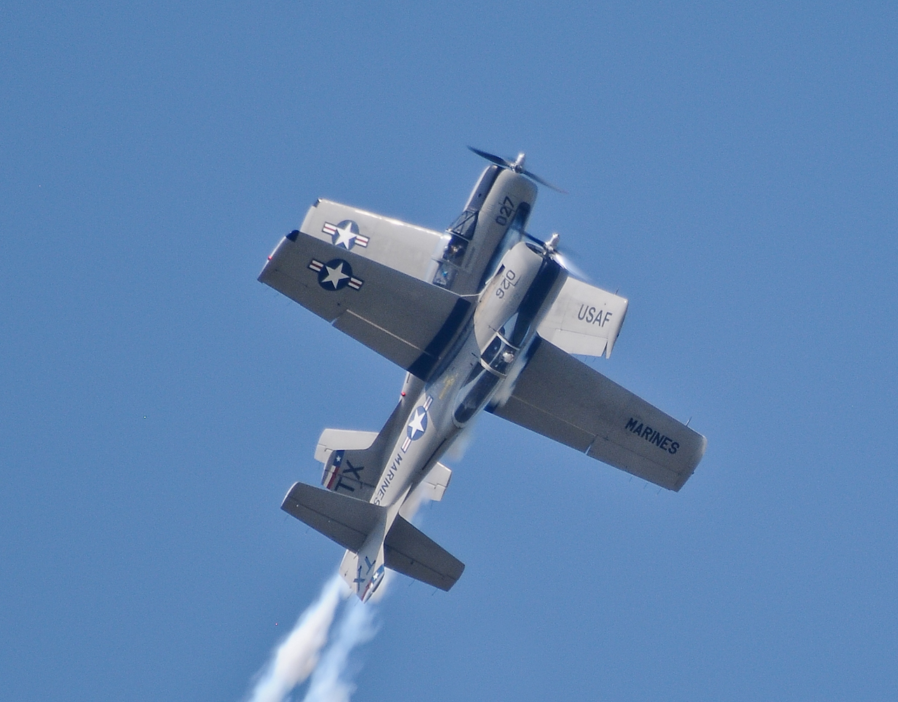 Trojan Phlyers Demonstration Team to Perform at Annual Stars and Stripes Air Show 12 The Trojan Phylers, Chip Lamb and John Sledge, break formation
