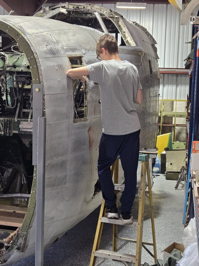 Restoration Begins: Project Warbird Breathes New Life into Consolidated LB.30 Liberator II AL557 17 Turner drilling rivets