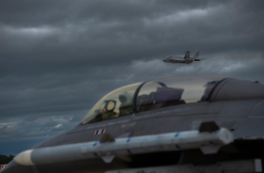 U.S. Air National Guard to Take Center Stage at EAA AirVenture Oshkosh 2025 10 U.S. Marine Corps F 35C Lightning II taking off above a 180th Fighter Wing F 16 Fighting Falcon