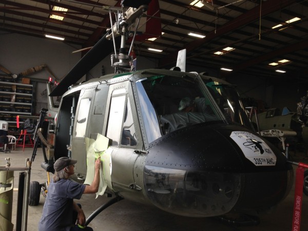 Yanks UH-1H Huey Unveiling 10 Yanks Air Museum's staff applying the last marking before the unveil.