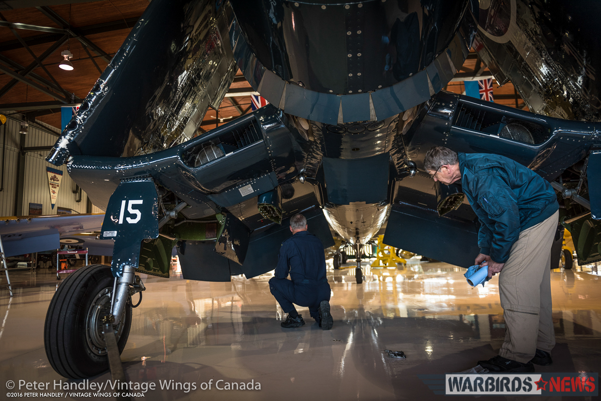Vintage Wings of Canada Corsair - Interview With Test Pilot Paul Kissman 22 Inspecting the Corsair after the flight. This is one of the most important stages in flying the aircraft... looking for the telltale signs of leaks and other issues, before anyone can clean the aircraft and therefor remove the important evidence of possible problems. (photo by Peter Handley)