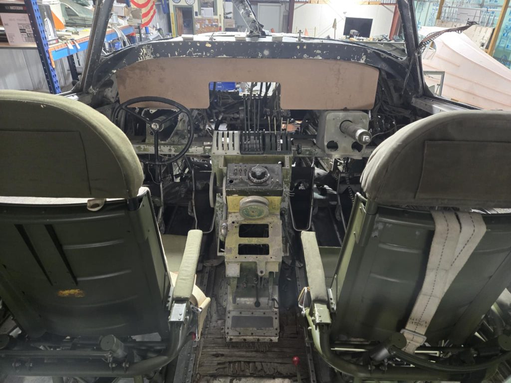 Restoration Begins: Project Warbird Breathes New Life into Consolidated LB.30 Liberator II AL557 16 Various components are temporarily placed in the cockpit of Maid of Athens. The yoke is on loan. The wood slab is the form for pressing the instrument panel