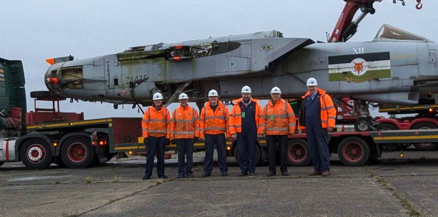 Gulf War Tornado GR1 Donated to Solway Aviation Museum 13 Volunteers stand in front of the Tornado ZA475 fuselage which is sitting on a trailer