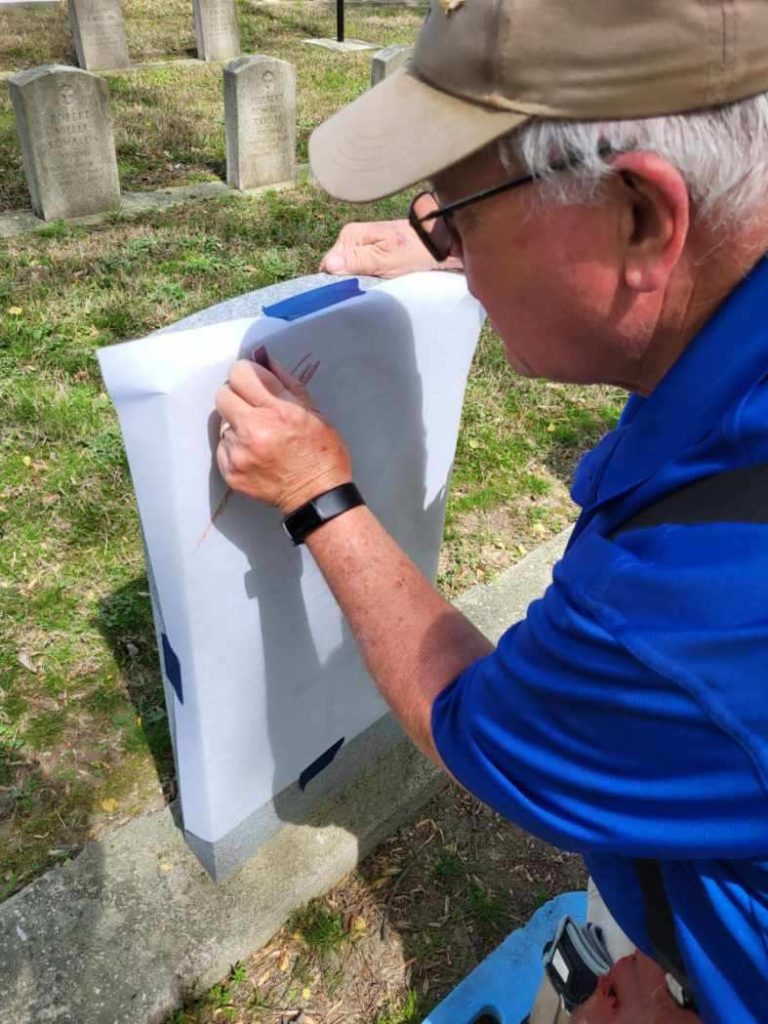 “Bringing the Boys Back Home” Honors British WWII Servicemen Buried in the U.S. as Part of 80th Anniversary Commemorations of Allied Victory 15 Woody Brooks Amy Wilkins Rubbing Gravestones at Forest Lawn Norfolk Virginia 1