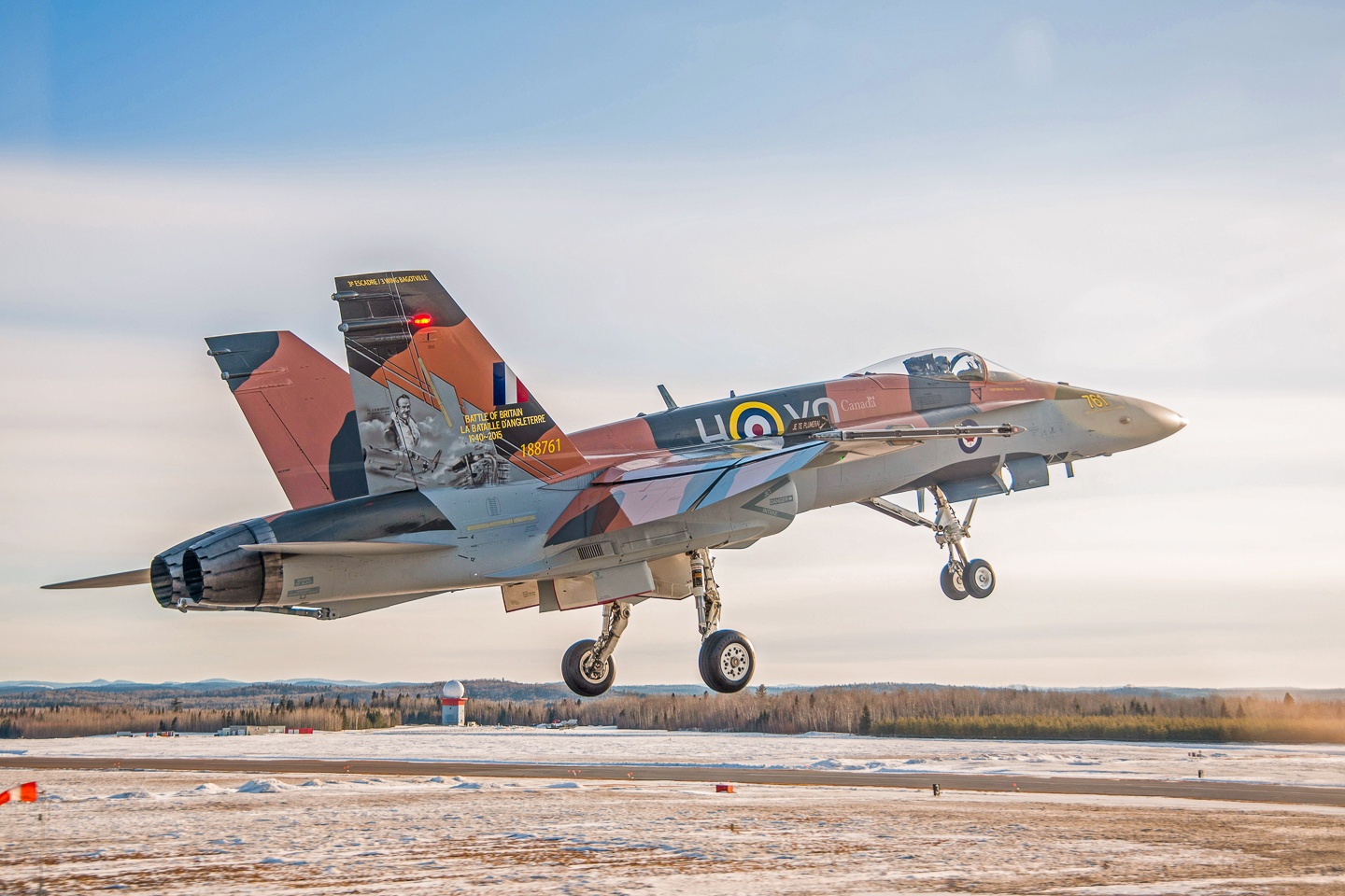 Battle of Britain - RAF/RCAF 75th Anniversary Schemes 17 The 2015 CF-18 Hornet Demonstration Aircraft flies over the Saguenay River on April 1st, 2015 near 3 Wing Bagotville, Saguenay, Qué. (Image: Canadian Armed Forces - LS Alex Roy, Atelier d'imagerie Bagotville.)