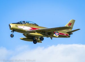 Air Show Report:Wings Over Gatineau 12 Mike "Woody" Woodfield waves to the crowd as he performs a slow fly-by in "Hawk One" at the Wings Over Gatineau air show.